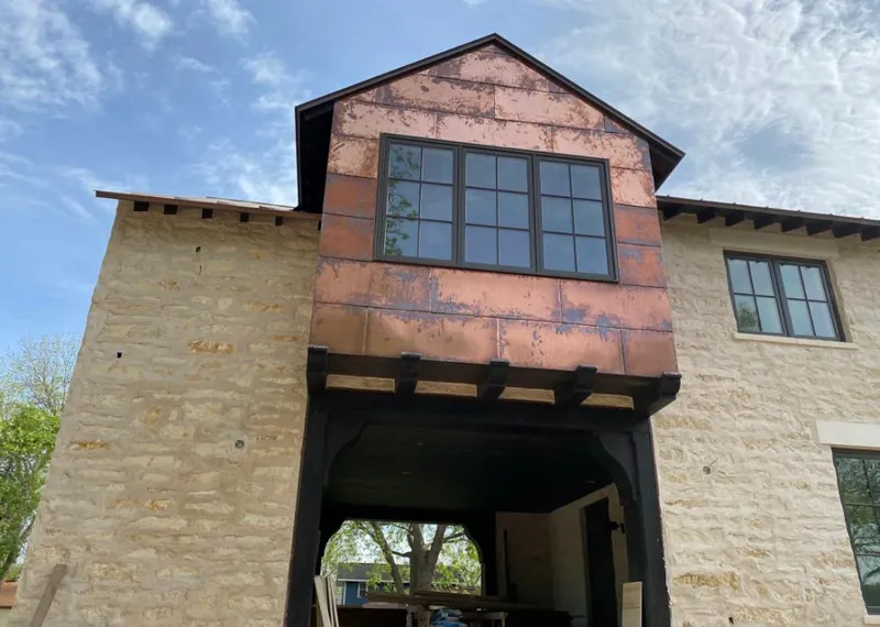 Copper metal panel facade on a stone building for Metal Roof Coating in South Pasadena